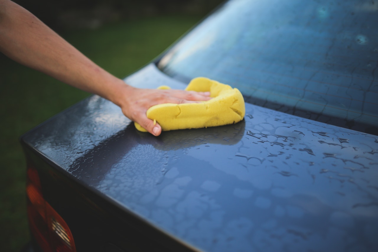 washing a car with a sponge 